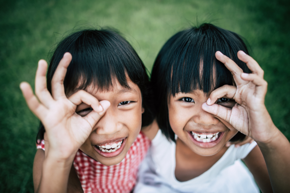 two-little-girls-friends-playing-funny-park